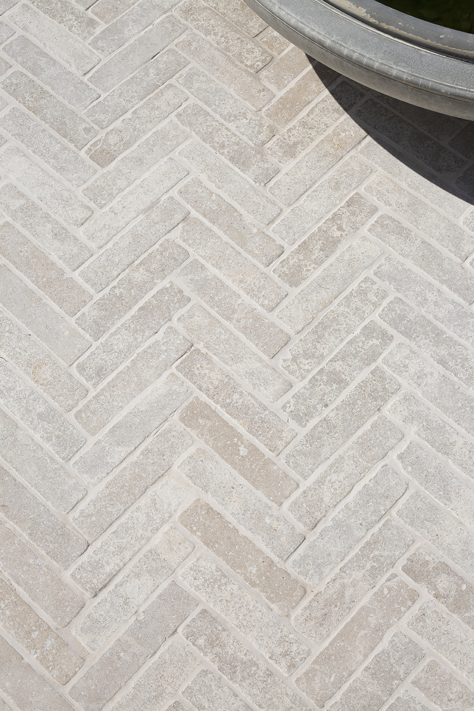 Dijon Tumbled Limestone Herringbone Paving Cobbles